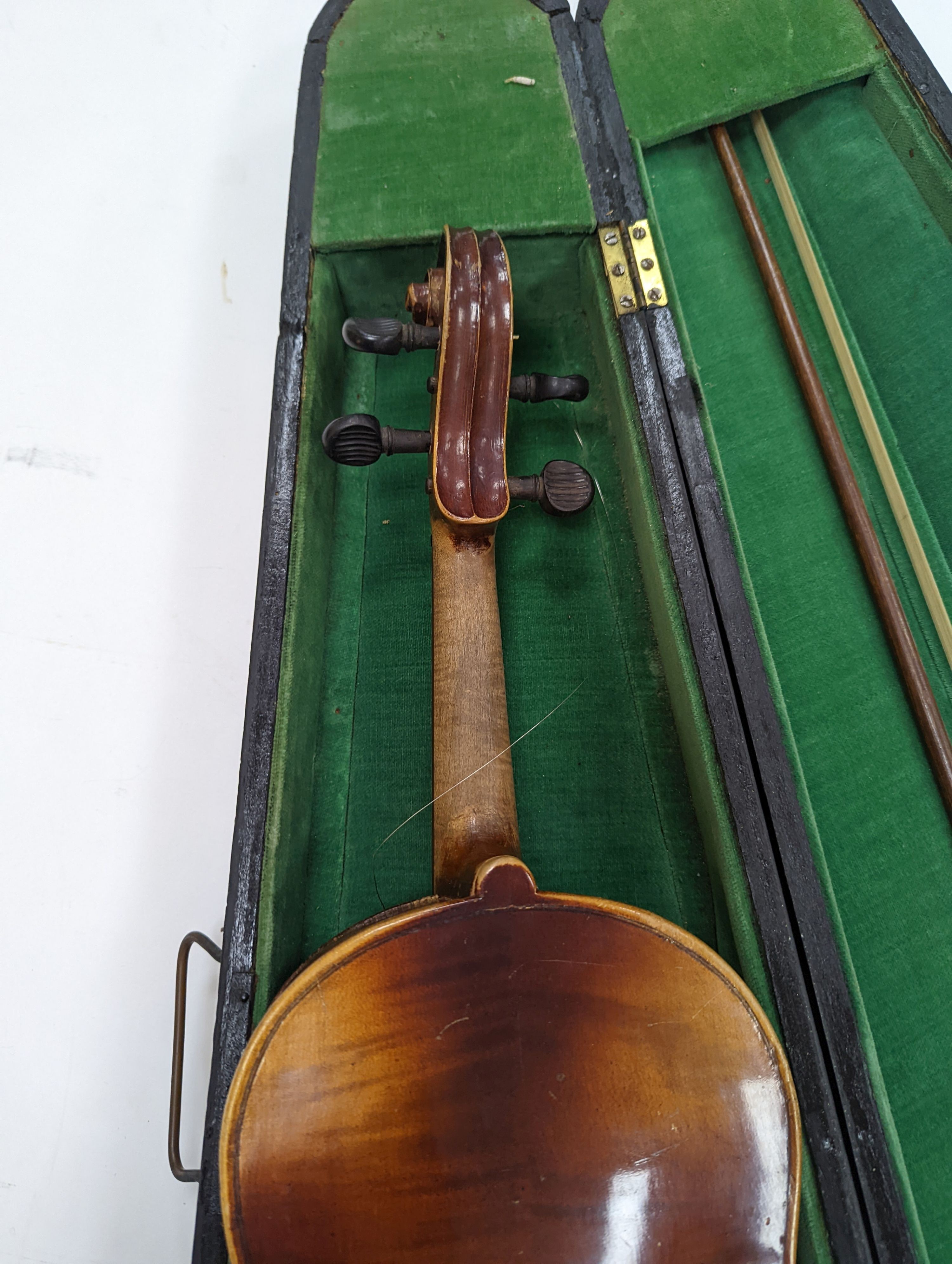 Two cased violins and bows, one with ‘Antonius Straduarius Cremonensis Faciebat Anno 17/13 Made In Czechoslovakia’ label to interior